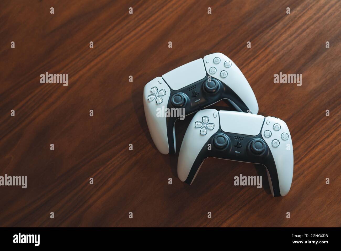 London, UK - May 25, 2021: Playstation 5 (PS5) controllers on a table, copy  space. Playstation 5 is the latest video game console by Sony release in N  Stock Photo - Alamy