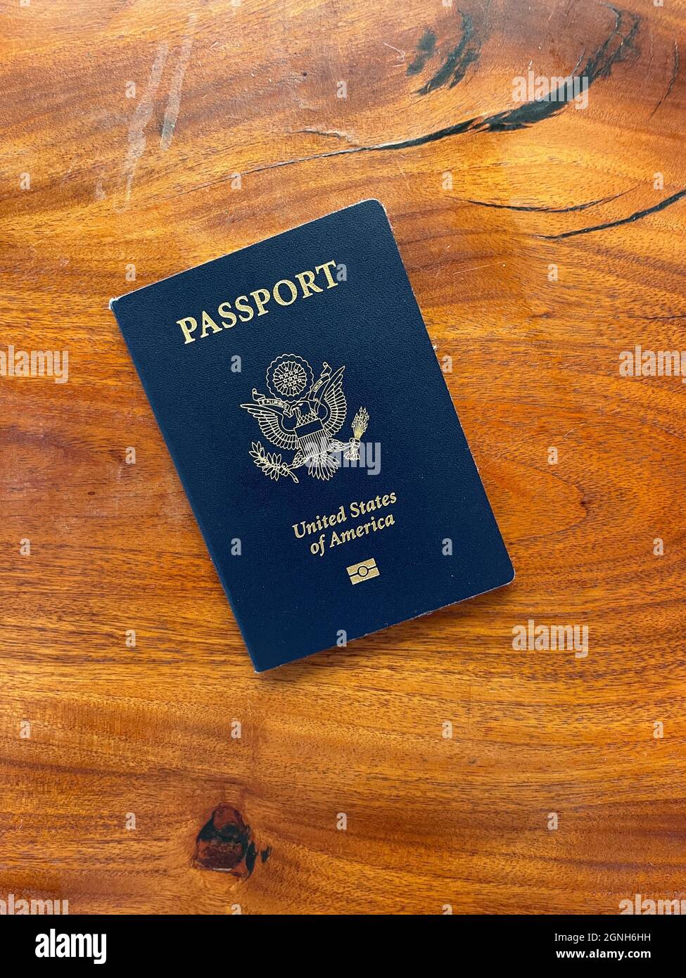 A United States of America Passport on wooden surface Stock Photo