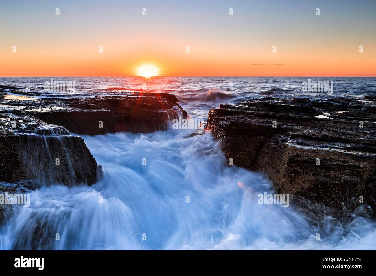 Scenic seascape at sunrise off NOrthern beaches - Pacific ocean coast in Sydney. Stock Photo