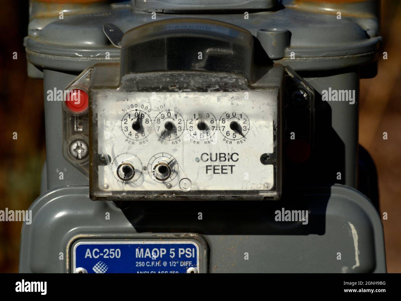 A gas meter in front of a home measures the amount of natural gas used by the home's residents