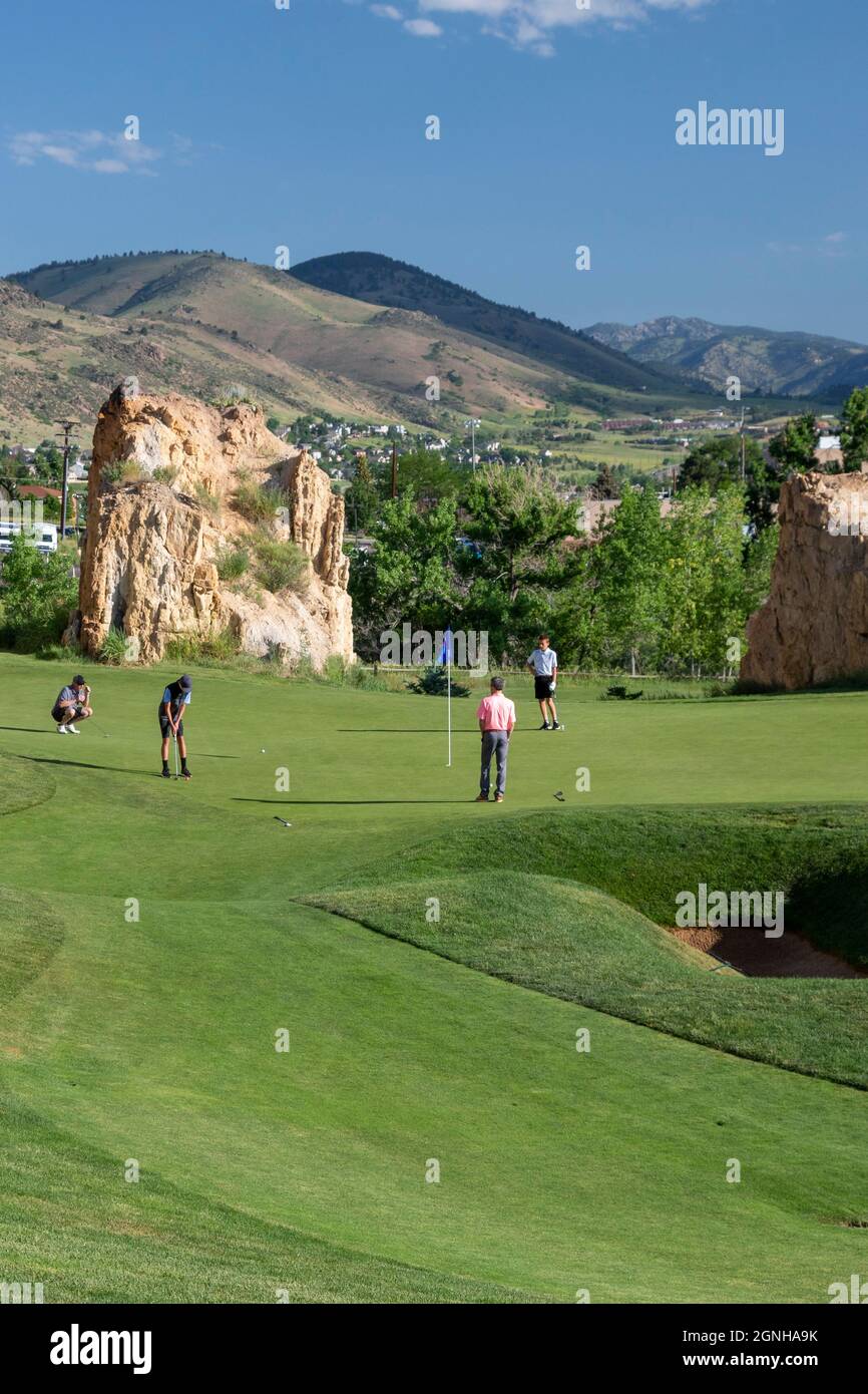 Golden, Colorado - The Fossil Trace Golf Course. Golfers play near footprints of dinosaurs and traces of other animals and plants from the Late Cretac Stock Photo