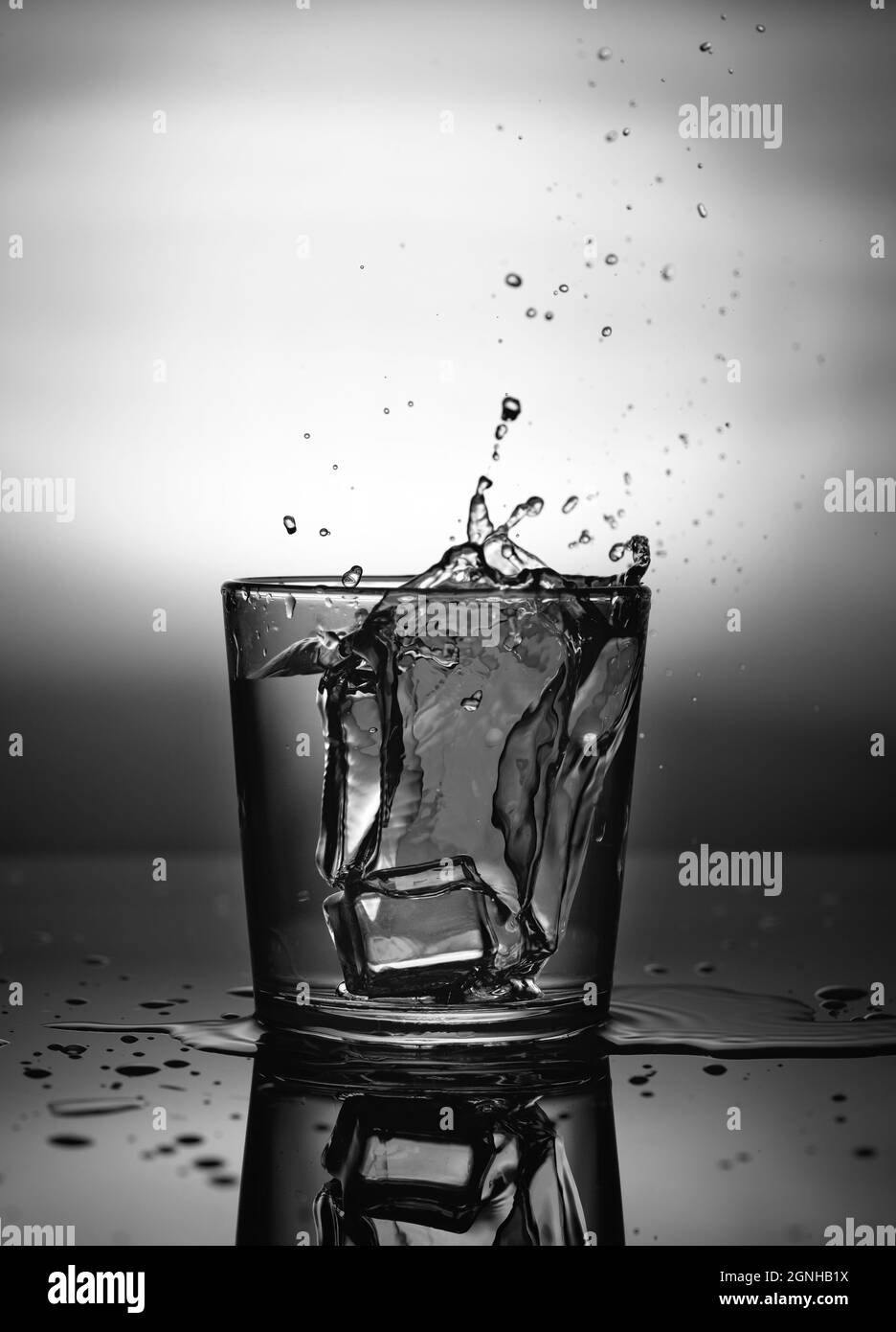 Ice cube falling glass water hires stock photography and images Alamy