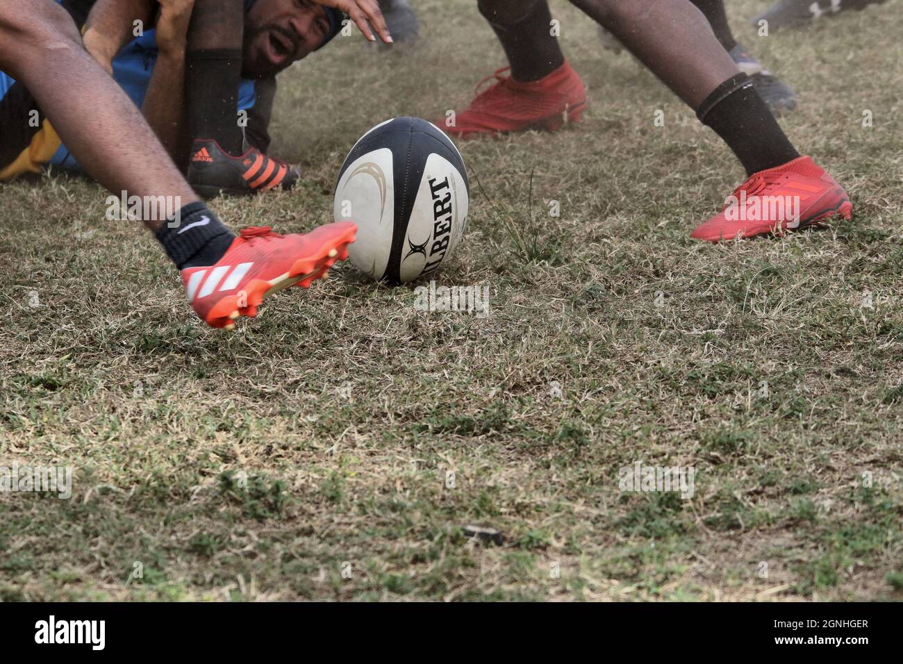 Athlete taking part in a game of Rugby trying to get the ball to defeat the other team. In order to achieve success and victory on the sporting field Stock Photo