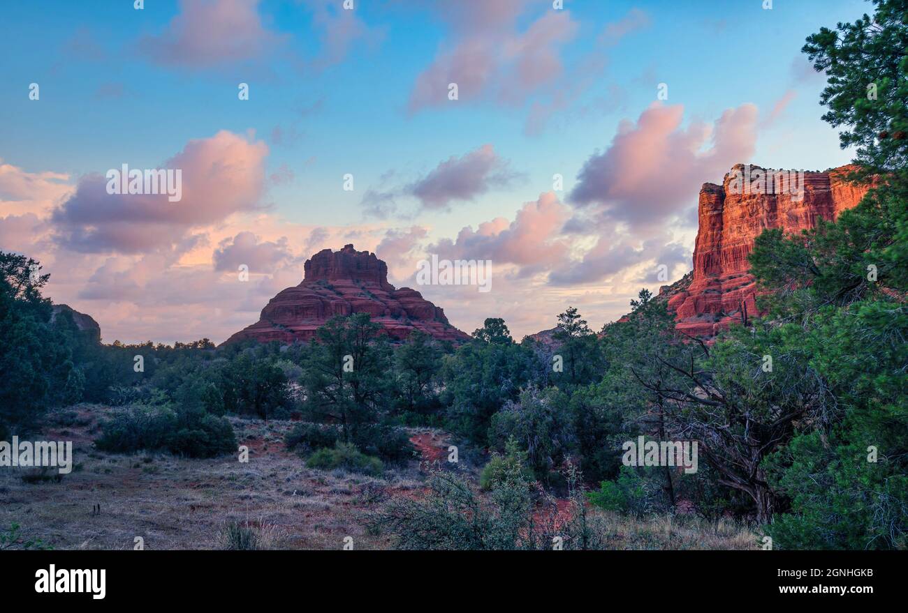 Bell Rock in Sedona Arizona with beautiful puffy sunset clouds Stock Photo
