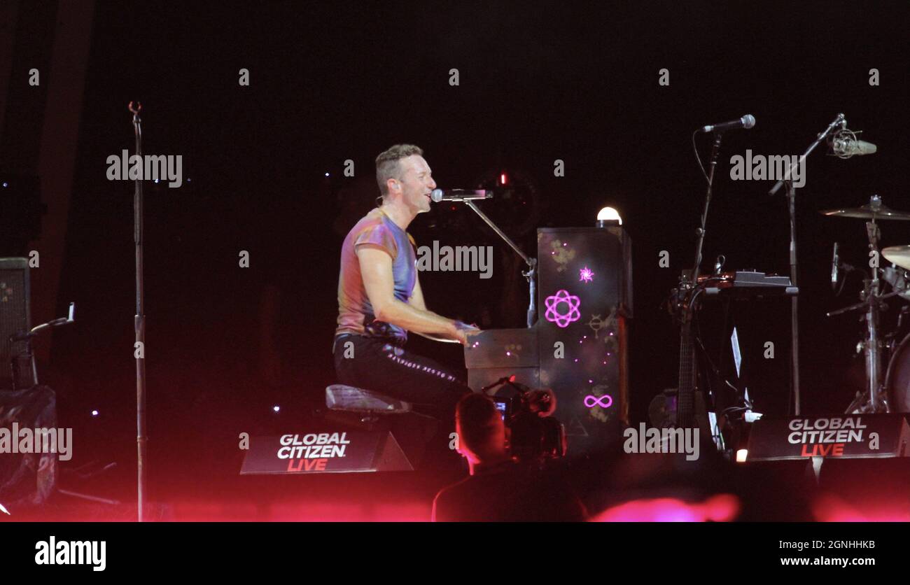 Coldplay band members performing live in the year 2021