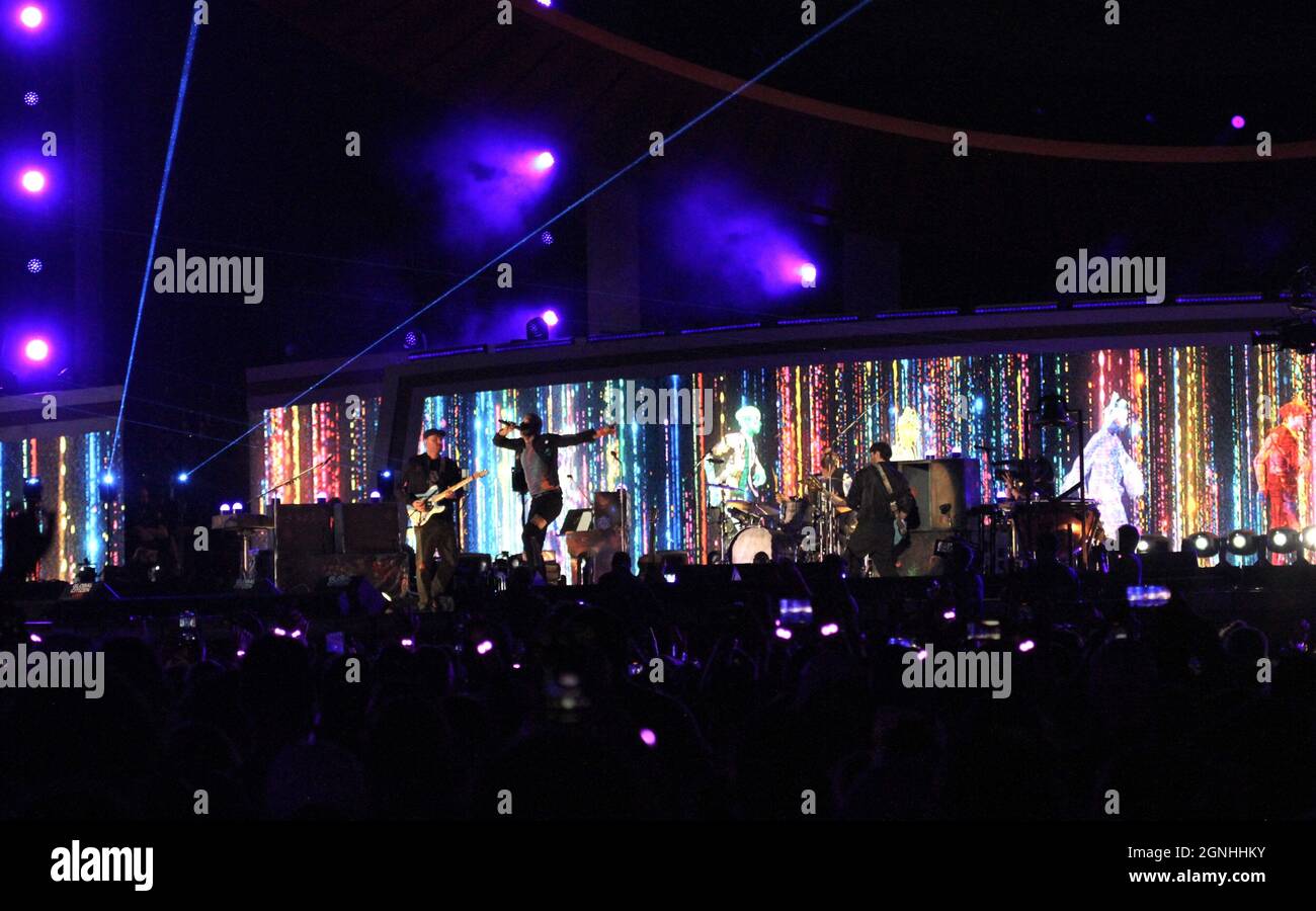 Coldplay performing live at a concert in the US in 2021