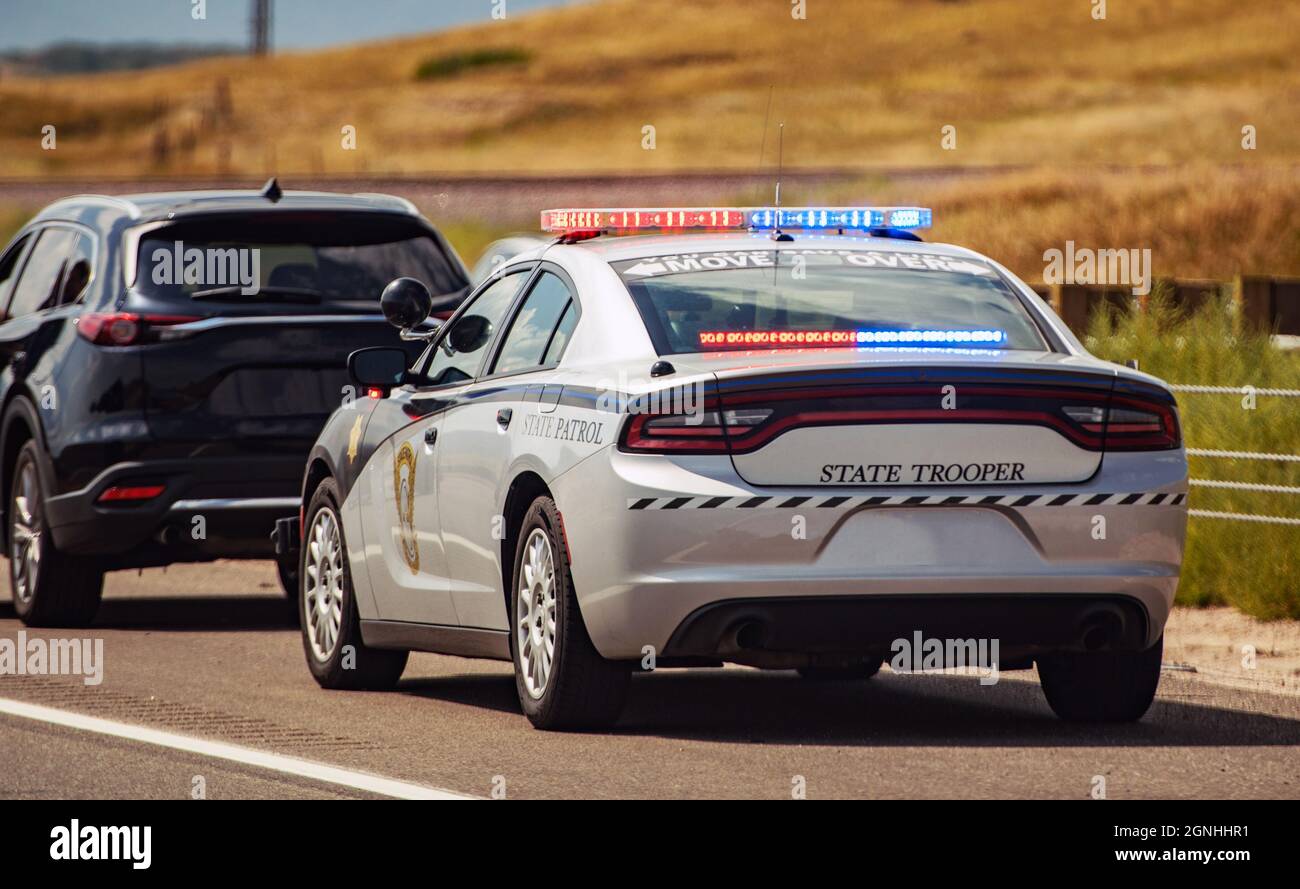 American Highway State Trooper Pulling Over Vehicle For Speeding Reason. Stock Photo