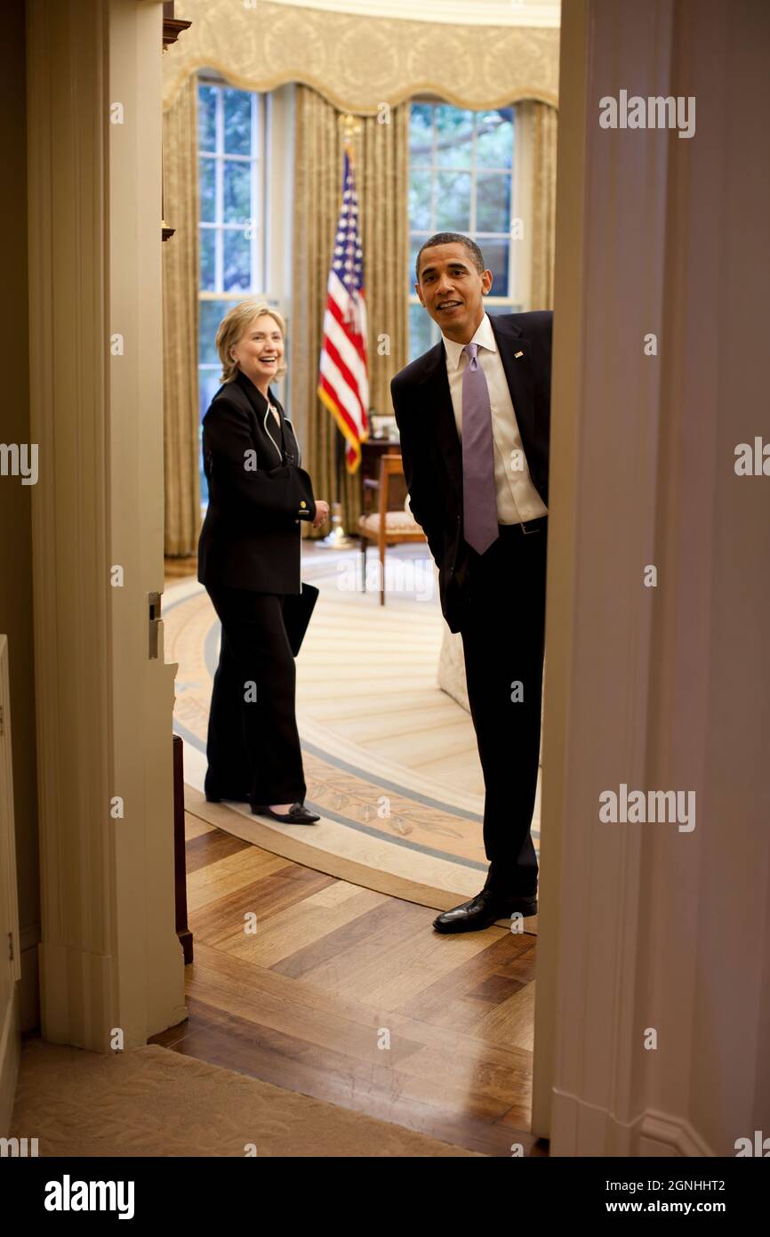 President Barack Obama during a meeting in the Oval Office with Secretary of State Hillary Clinton on July 1, 2009.   (Official White House Photo by Pete Souza)  This official White House photograph is being made available for publication by news organizations and/or for personal use printing by the subject(s) of the photograph. The photograph may not be manipulated in any way or used in materials, advertisements, products, or promotions that in any way suggest approval or endorsement of the President, the First Family, or the White House. Stock Photo