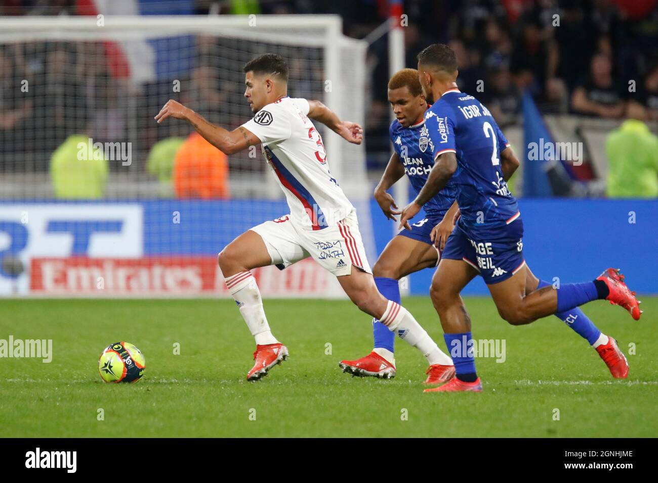 Bruno GUIMARAES of Lyon and Armand LORIENTE of Lorient and Igor SILVA DE ALMEIDA of Lorient during the French championship Ligue 1 football match between Olympique Lyonnais and FC Lorient on September 25, 2021 at Groupama stadium in Decines-Charpieu near Lyon, France - Photo Romain Biard / Isports / DPPI Stock Photo