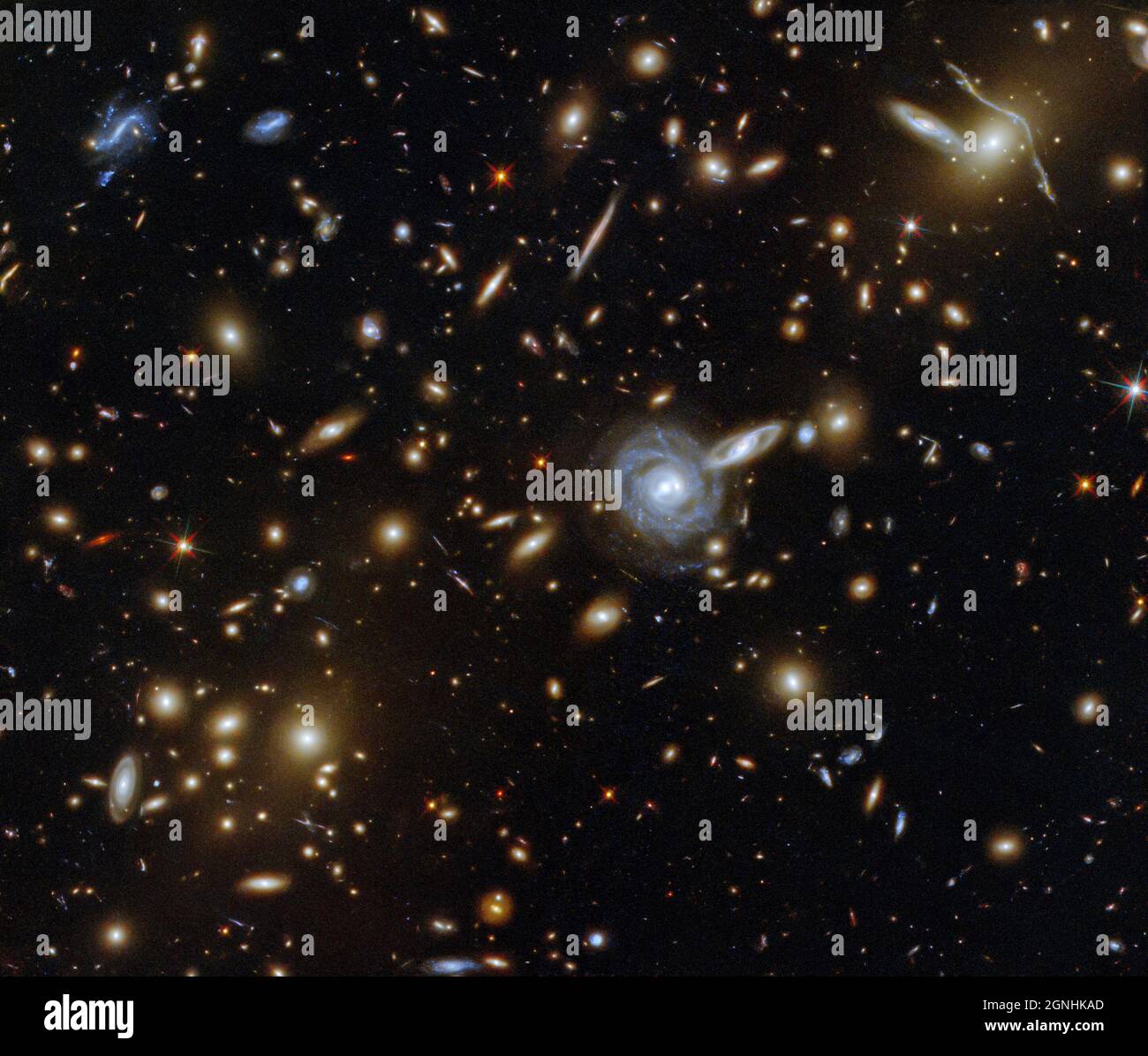 The galaxy cluster ACO S 295, with thousands of background galaxies and foreground stars. . Image source NASA/ESA Hubble Space Telescope Stock Photo