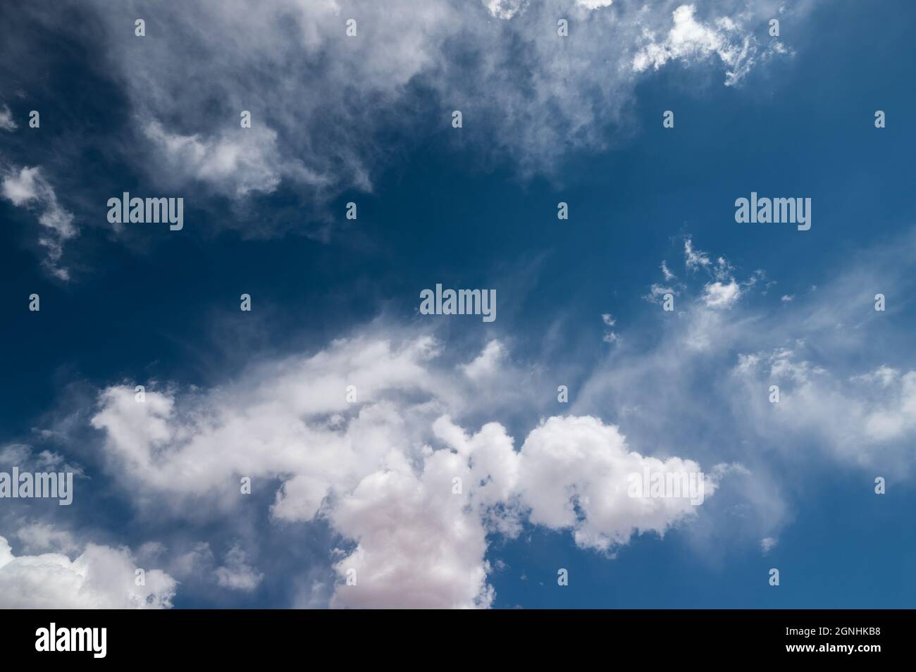 Blue sky with puffy white clouds Stock Photo