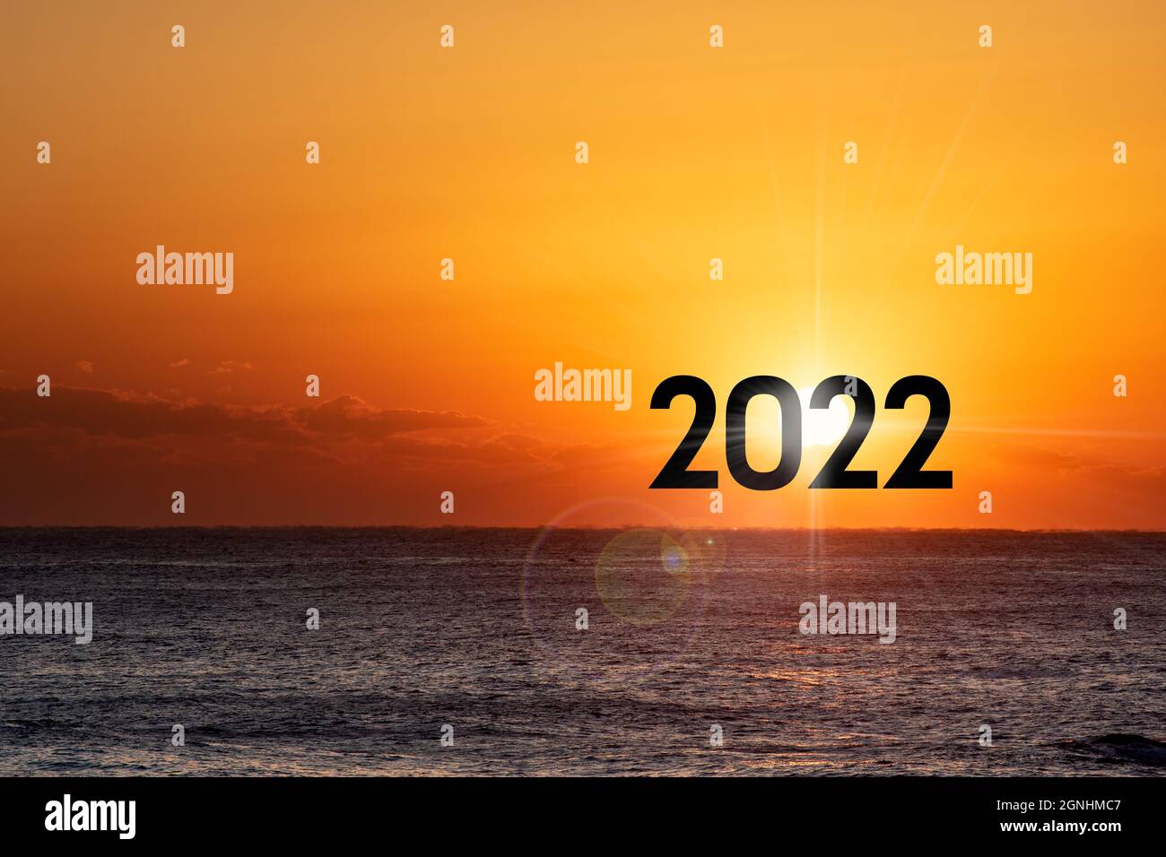 New Year 2022. Beautiful sunrise over the ocean Stock Photo