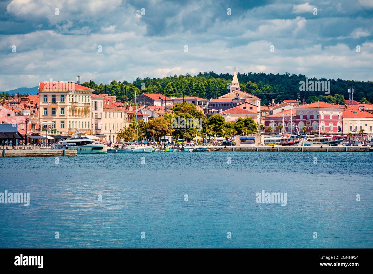 Colorful morning cityscape of popular summer resort Porec. Bright spring seascape of Adriatic Sea. Great  scene of Istrian Peninsula in western Croati Stock Photo