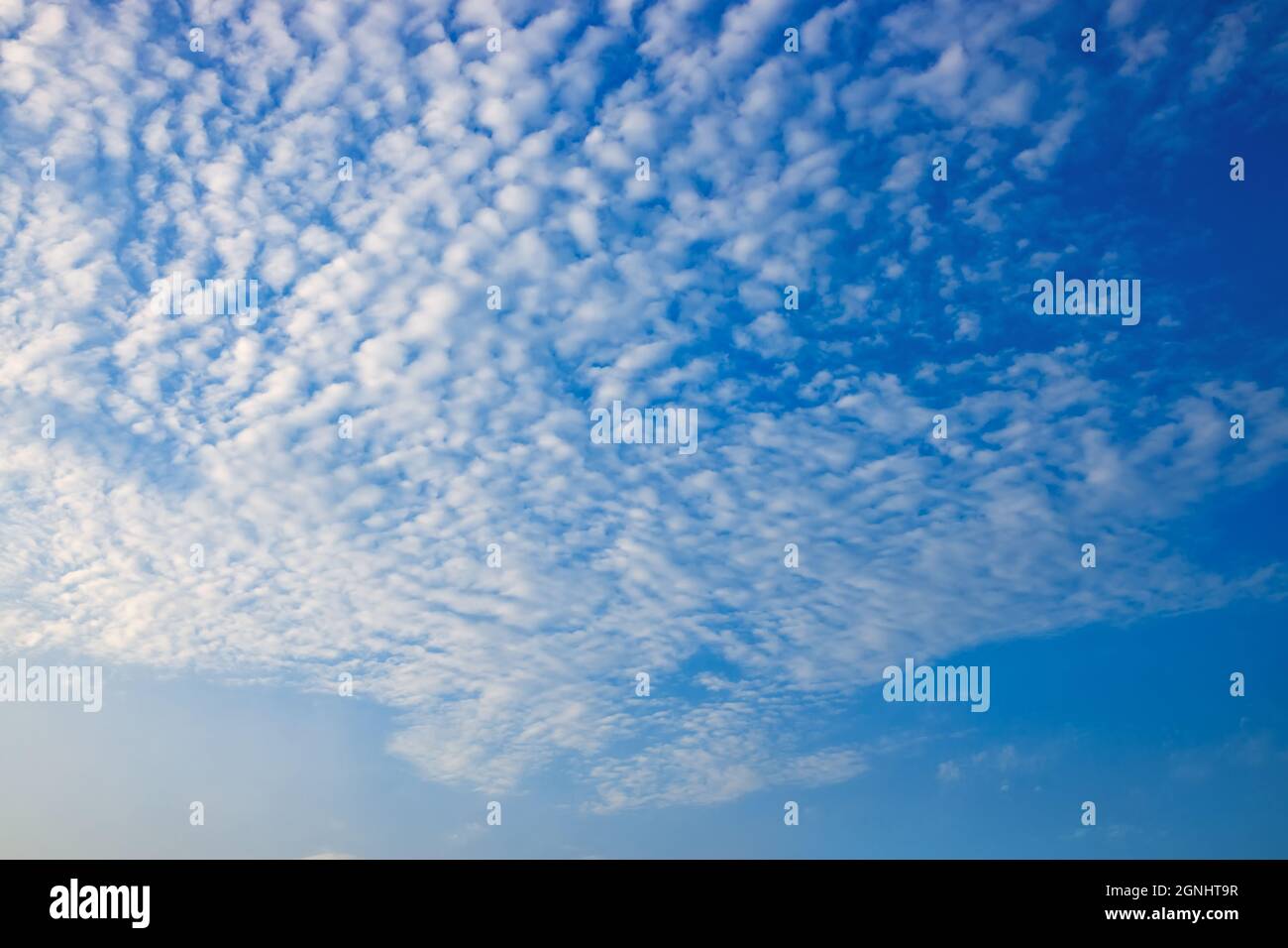 blue sky with white spindrift clouds on day Stock Photo