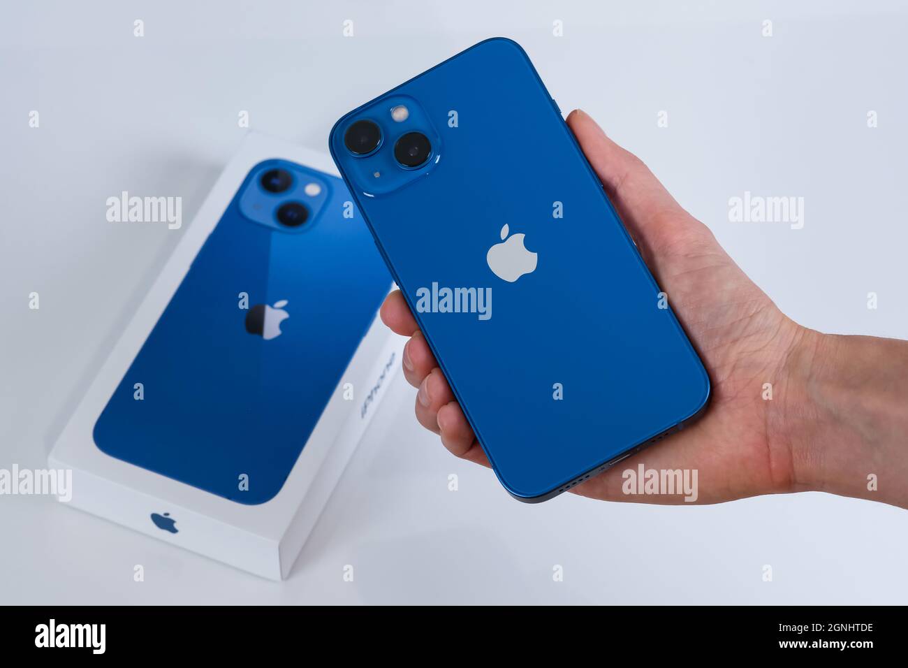 iPhone 13 in blue Stock Photo Alamy