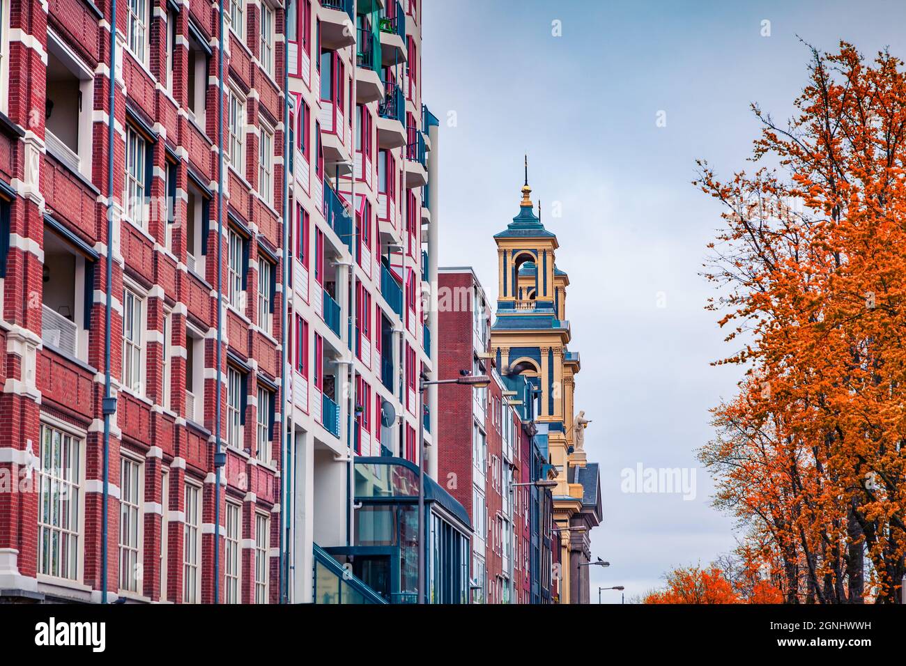 Fragment of typical Dutch architecture in Amsterdam city. Colorful autumn morning in Netherlands, Europe. Traveling concept background. Stock Photo