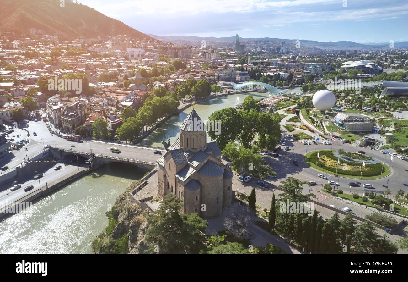 Church in center of Tbilisi city on Rike park background aerial drone view Stock Photo