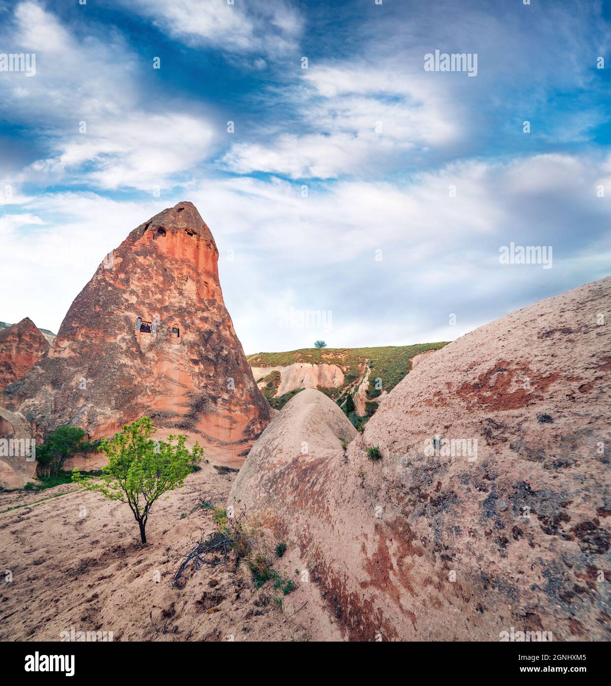 Unreal world of Cappadocia. Beautiful summer view of Uchisar Castle. Sunny morning scene of famous Uchisar village, district of Nevsehir Province in t Stock Photo