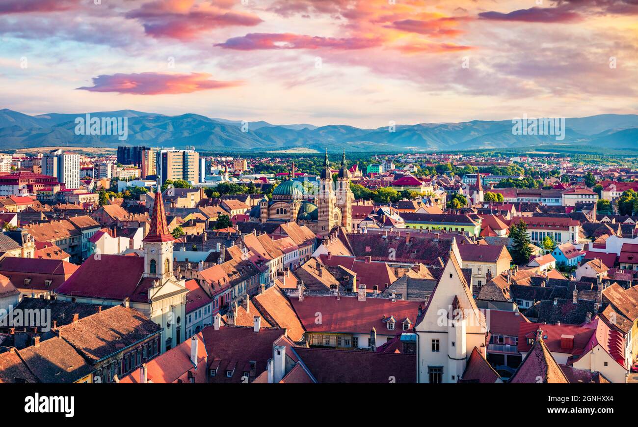 Aerial summer view of Cathedral of the Holy Trinity. Colorful morning cityscape of Sibiu town. Impressive sunrise in Transylvania, Romania, Europe. Tr Stock Photo
