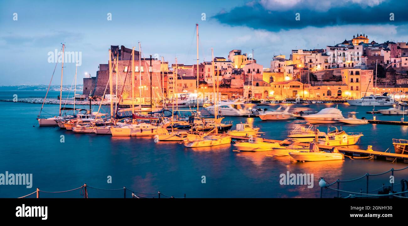 Fantastic evening cityscape of of Castellammare del Golfo town. Dramatic seascape of Mediterranean sea. Picturesque scene of Sicily, Trapani Province, Stock Photo