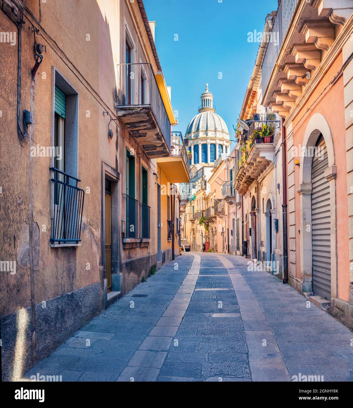 Bright spring cityscape of Ragusa town with  Duomo San Giorgio - baroque Catholic church on background. Nice morning scene of Sicily, Italy, Europe. T Stock Photo
