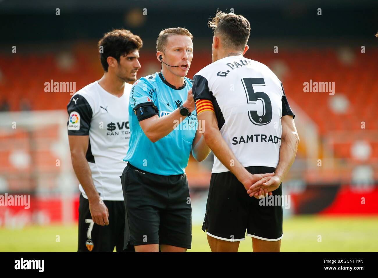 A referee with Gabriel Paulista of Valencia CF during the La Liga match between Valencia CF and Athletic Club at Mestalla Stadium in Valencia, Spain. Stock Photo