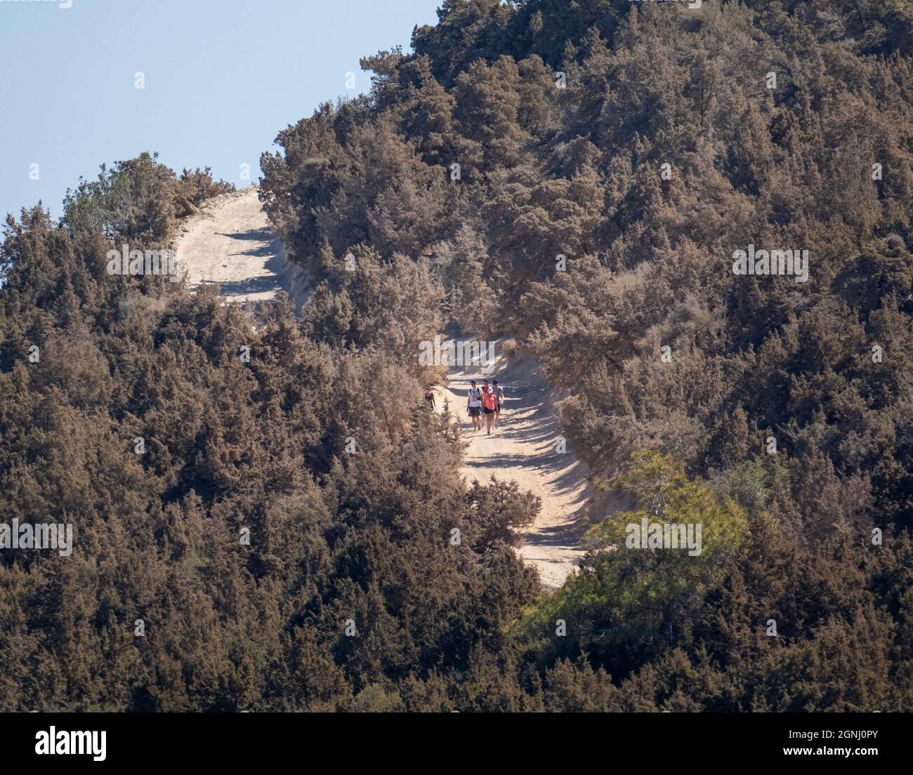 Group of people walking to the Blue Lagoon on the Akamas peninsula, Cyprus. Stock Photo