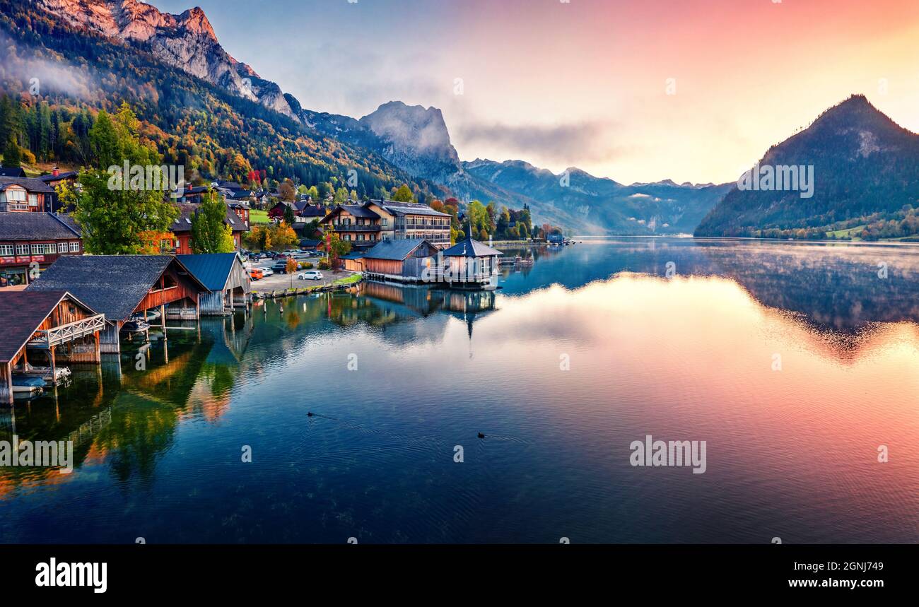 View from flying drone. Awesome sunrise on Grundlsee lake. Breathtaking morning view of Eastern Alps, Liezen District of Styria, Austria, Europe. Aeri Stock Photo