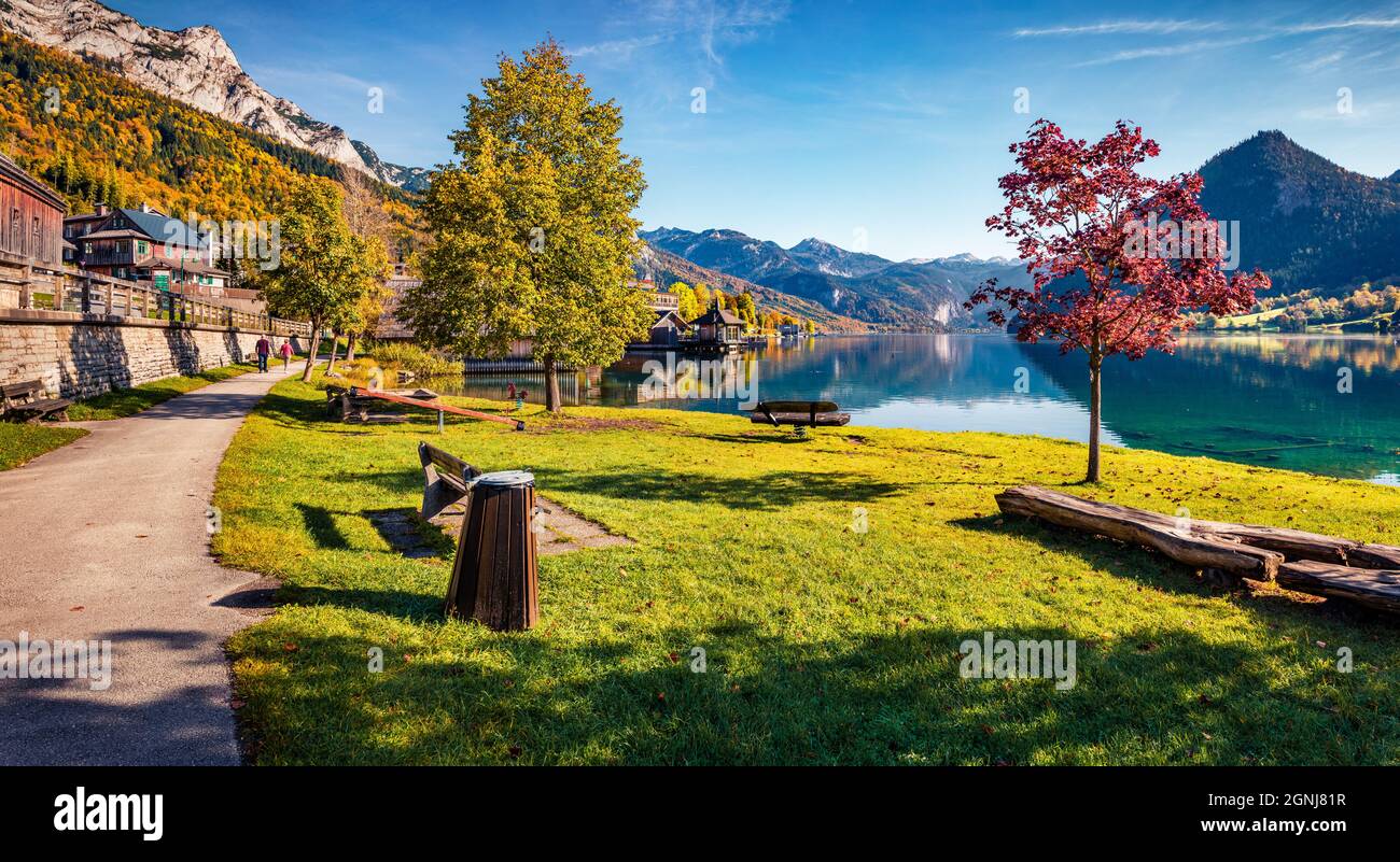Panoramic morning view of Grundlsee village. Sunny autumn view of Eastern Alps, Liezen District of Styria, Austria, Europe. Splendid outdoor scene of Stock Photo
