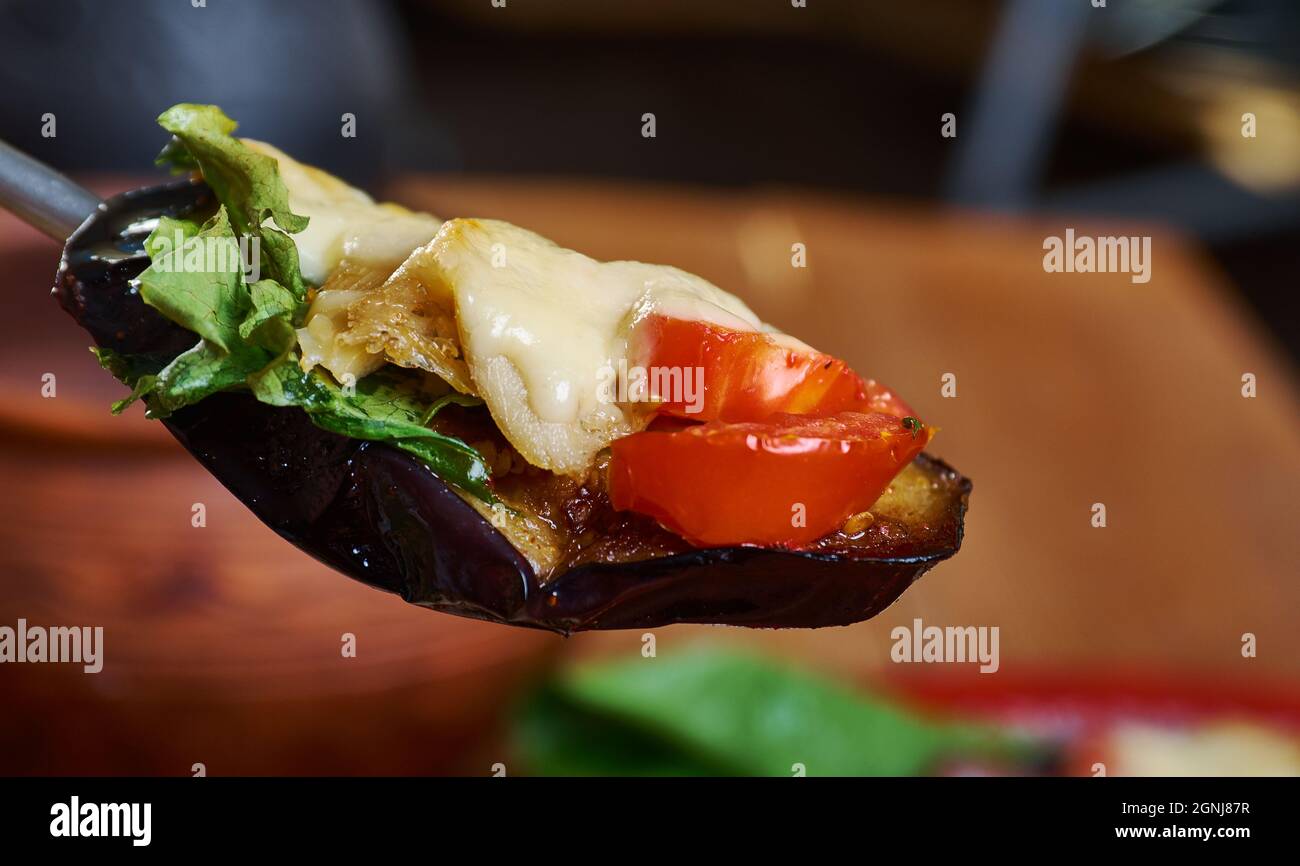 Melanzane al forno Baked eggplant with anchovies and cheese Stock Photo