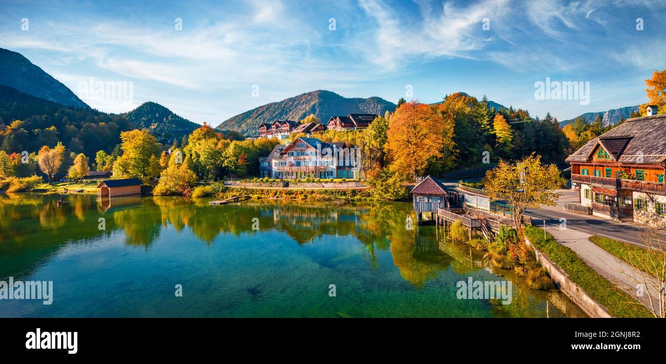 View from flying drone. Stunning morning scene of Grundlsee village and lake. Magnificent autumn view of Eastern Alps, Liezen District of Styria, Aust Stock Photo