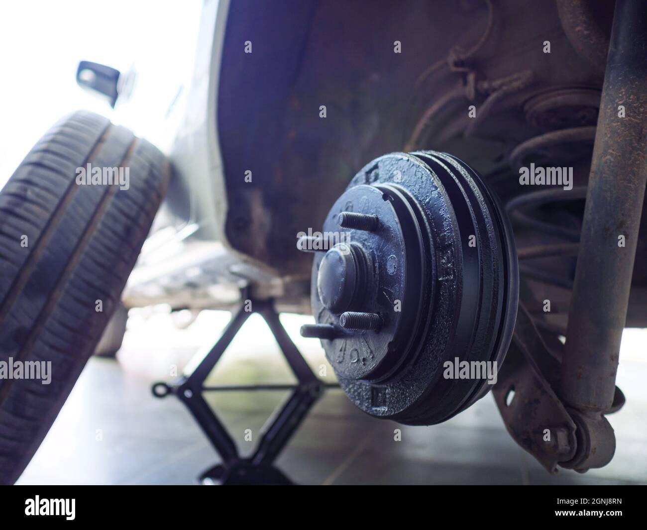 A rear hub of the car after removing a tire and wheel, maintaining a ...