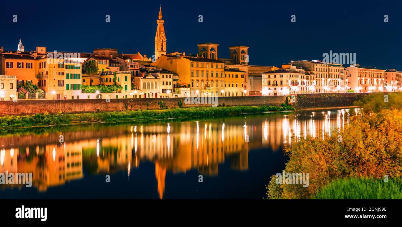 Night summer view of Basilica of Santa Croce church and Arno river. Panoramic evening cityscape of Florence, Tuscany, Italy. Traveling concept backgro Stock Photo
