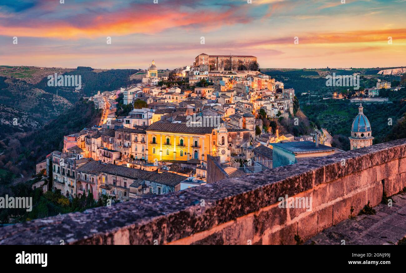 Captivating summer cityscape of Ragusa town with Palazzo Cosentini and Duomo di San Giorgio church on background. Colorful sunset in Sicily, Italy, Eu Stock Photo