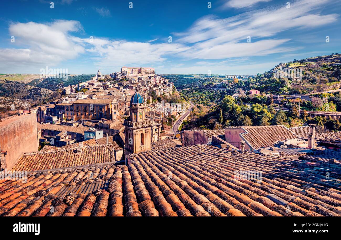 Marvelous summer cityscape of Ragusa town with Palazzo Cosentini and Duomo di San Giorgio church on background. Bright afternoon scene of Sicily, Ital Stock Photo