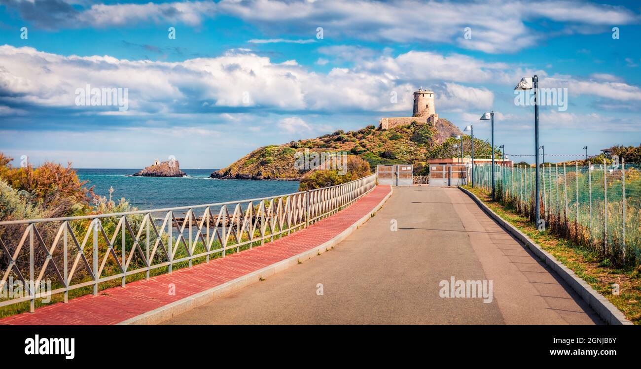 Superb spring view of Torre del Coltellazzo o di Sant'Efisio tower. Picturesque morning scene of Sardinia island, Italy, Europe. Stunning seascape of Stock Photo