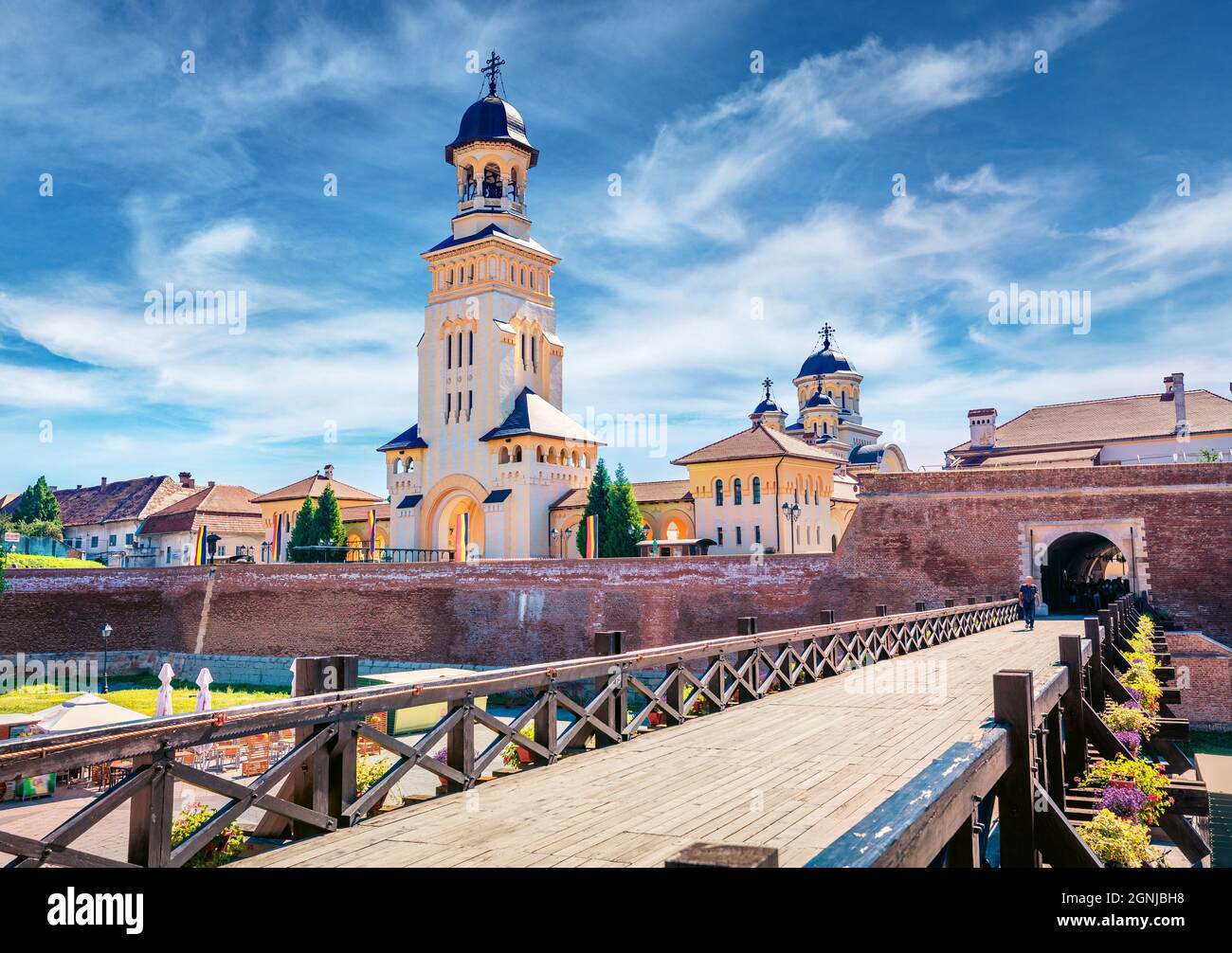 Sunny morning view of bell tower of Reunification Cathedral, Fortified churches inside Alba Carolina Fortress. Stunning summer cityscape of Alba Iulia Stock Photo