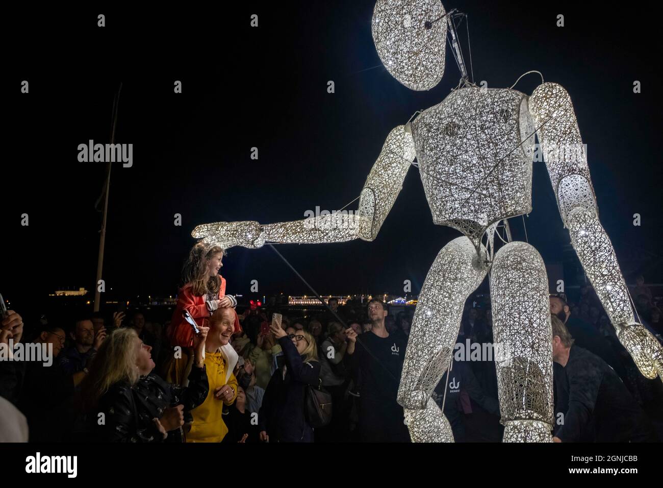 Sense of Unity Parade, Weymouth, Dorset, UK. 25th Sep, 2021. Drummers accompany the 'gentle giant, Dundu' an illuminated walking puppet, through the streets of Weymouth marking the end of the two week international arts festival Inside Out Dorset. Credit: Tom Corban/Alamy Live News Stock Photo