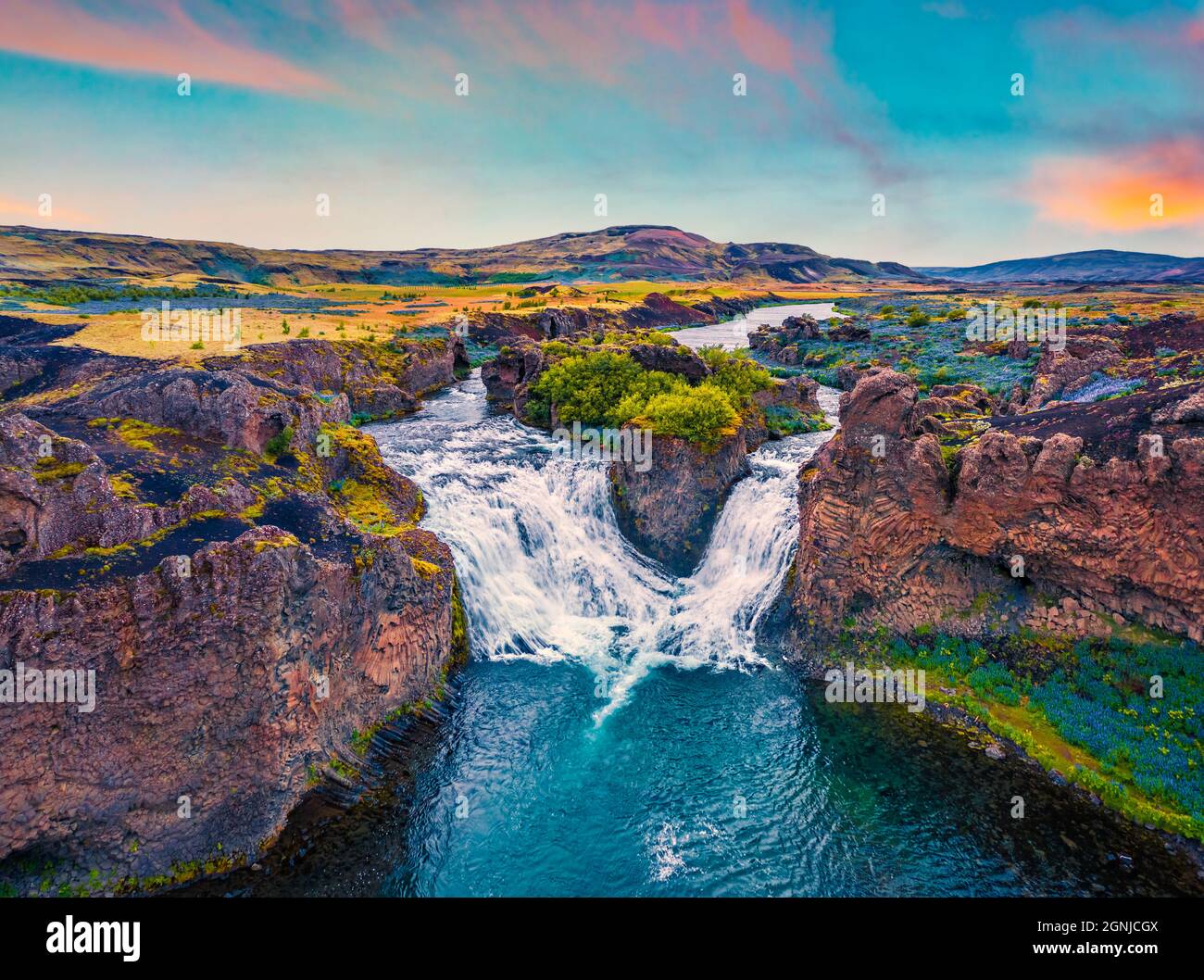 View from flying drone. Majestic summer sunset on Hjalparfoss Waterfall.  Picturesque evening scene of Iceland, Europe. Beauty of nature concept  backgr Stock Photo - Alamy