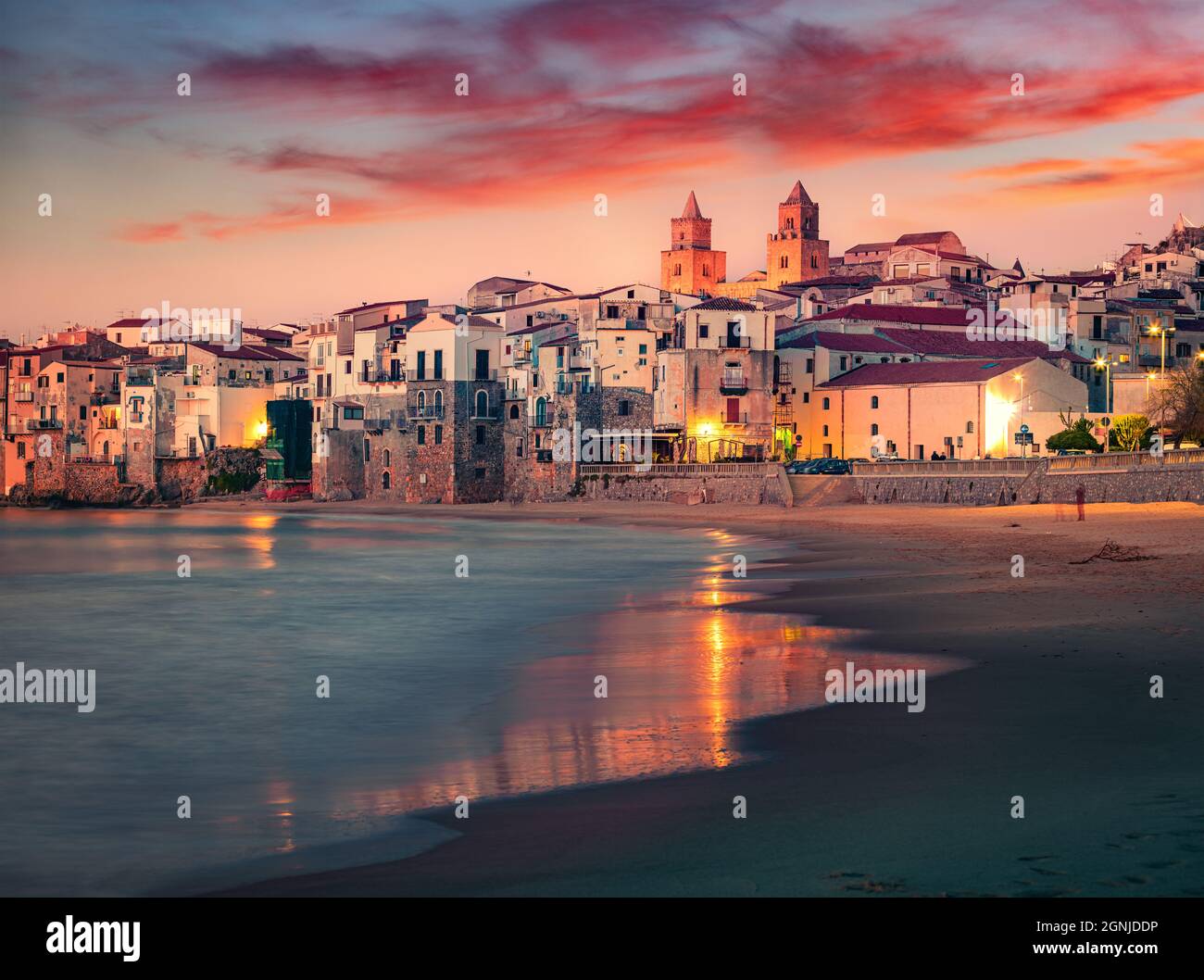 Spectacular spring cityscape of Cefalu town with Piazza del Duomo. Impressive sunset on Mediterranean sea, Sicily, Italy, Europe. Traveling concept ba Stock Photo
