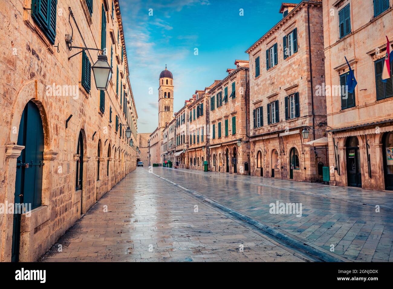Empty street of Dubrovnik. Early morning view of Cathedral. Splendid summer cityscape of Old Town of Dubrovnik, Croatia, Europe. Beautiful world of Me Stock Photo