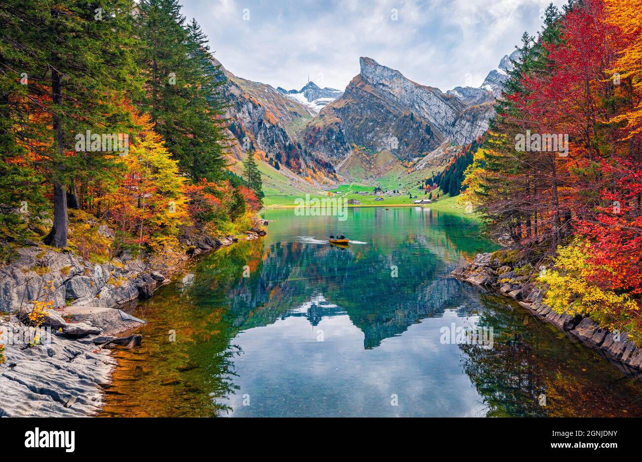 Incredible morning view of Seealpsee lake, Switzerland. Captivating autumn scene of Swiss Alps. Majestic Santis peak reflected in the calm surface of Stock Photo