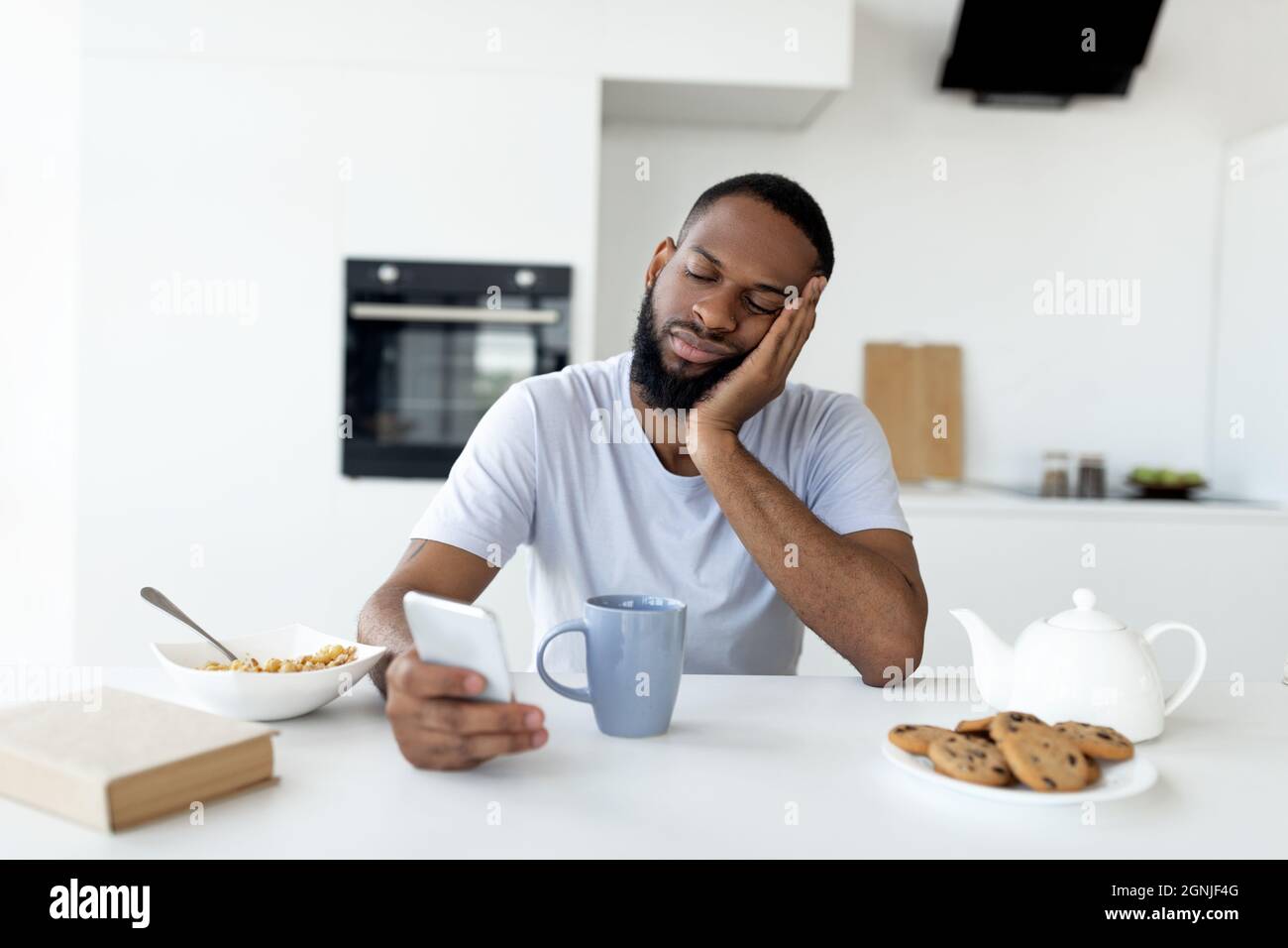 Tired young african man having hi-res stock photography and images - Alamy