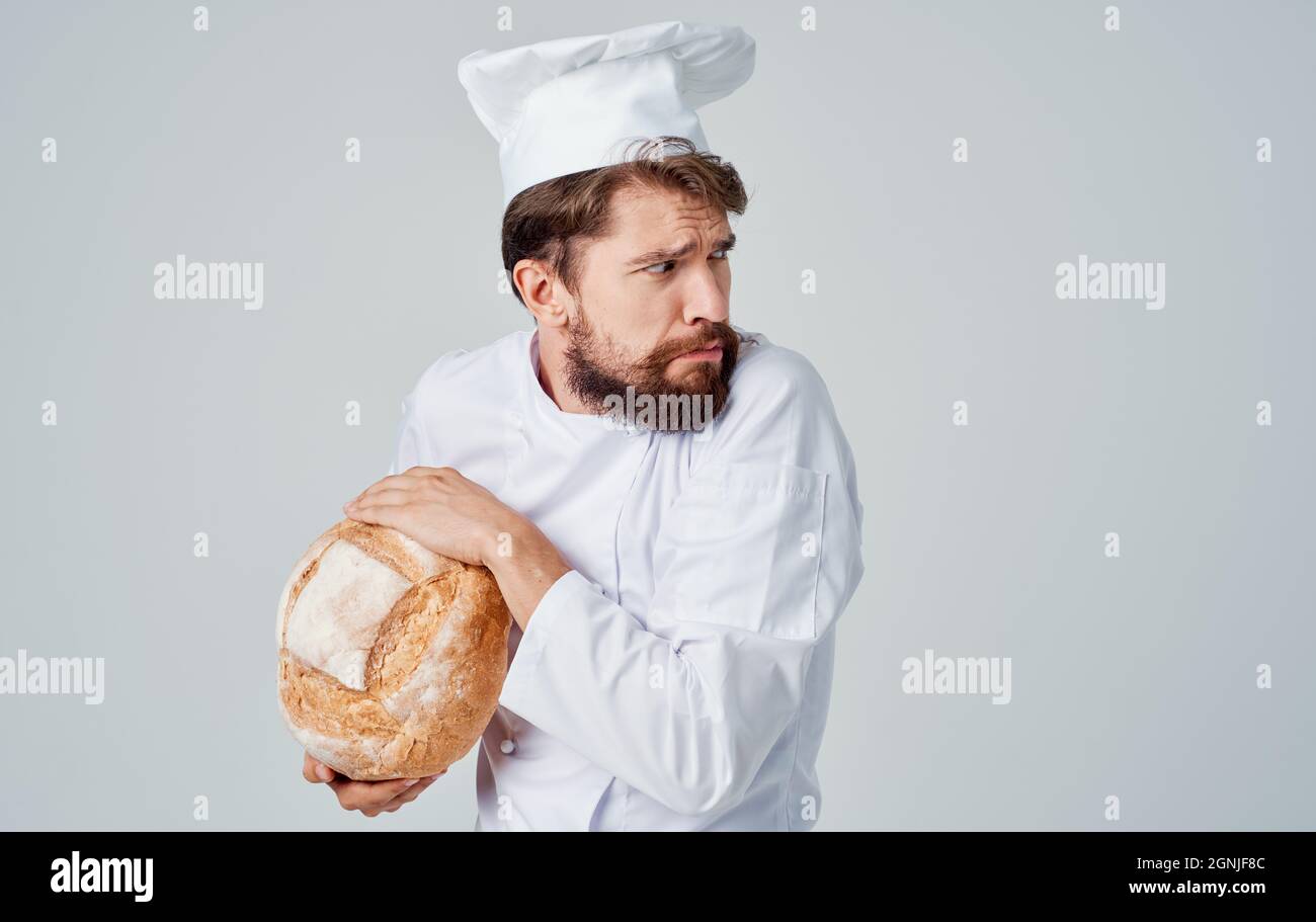 male cook kitchen Job bakery products light background Stock Photo Alamy