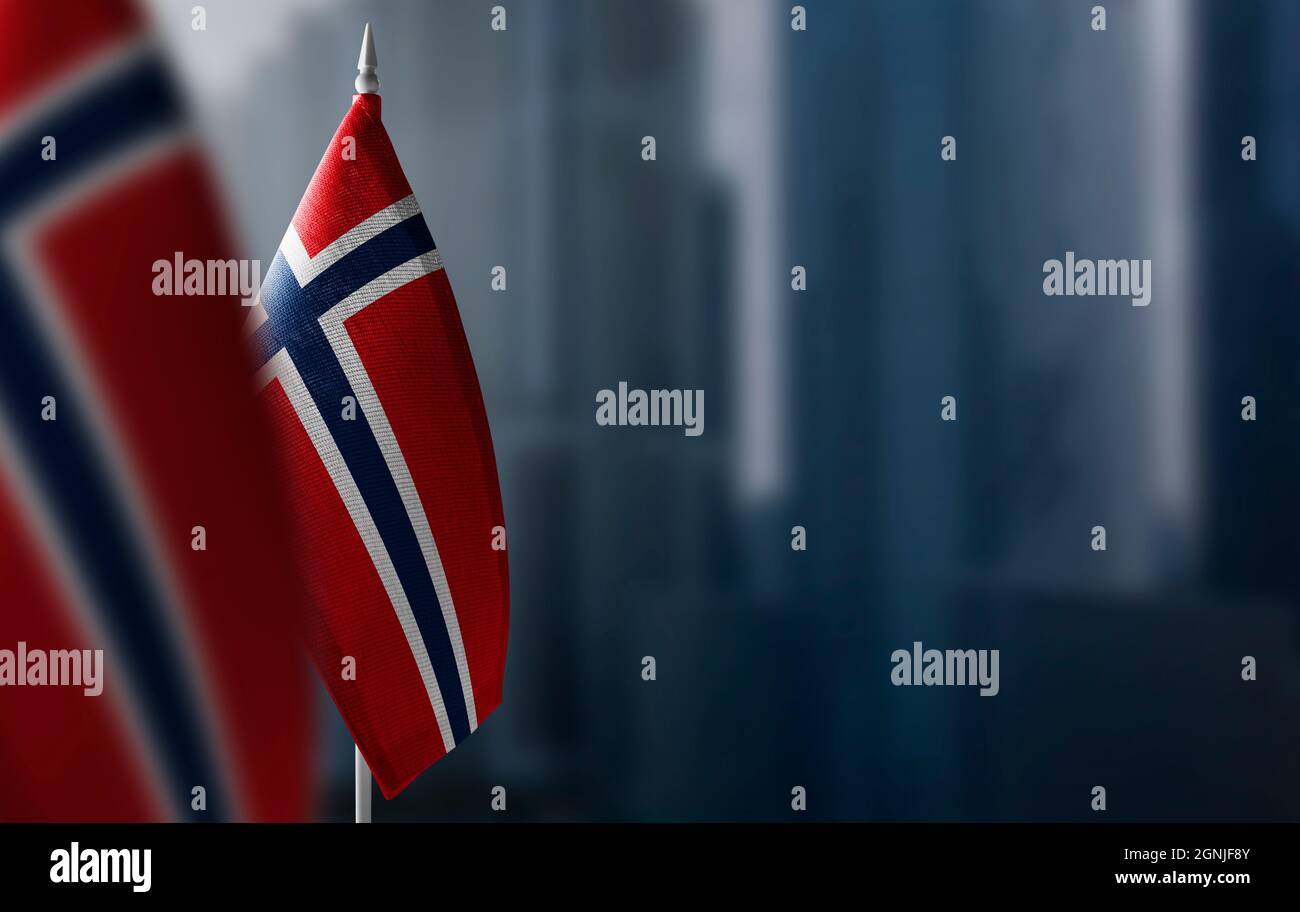 Small flags of Norway on a blurry background of the city Stock Photo ...