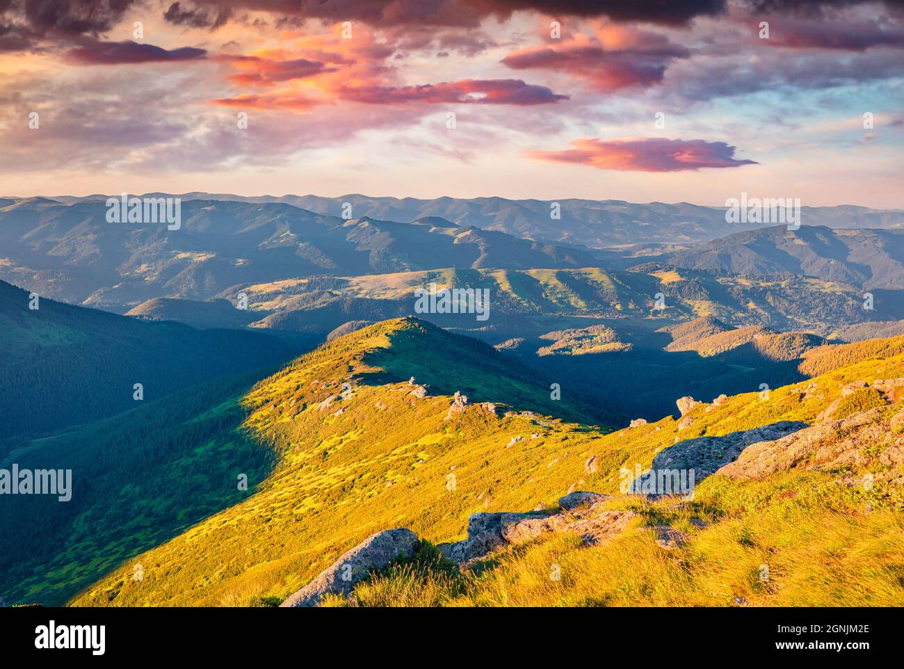 Fantastic cloudscape in Carpathian mountains. Amazing sunset on Dzembronya village location, Ukraine, Europe. Beauty of nature concept background. Stock Photo