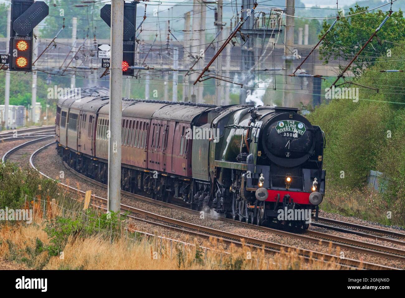 SR Merchant Navy Class 35018 British India Line restored steam locomotive, seen running south on the West Coast Main Line at Winwick hauling the Lune Stock Photo