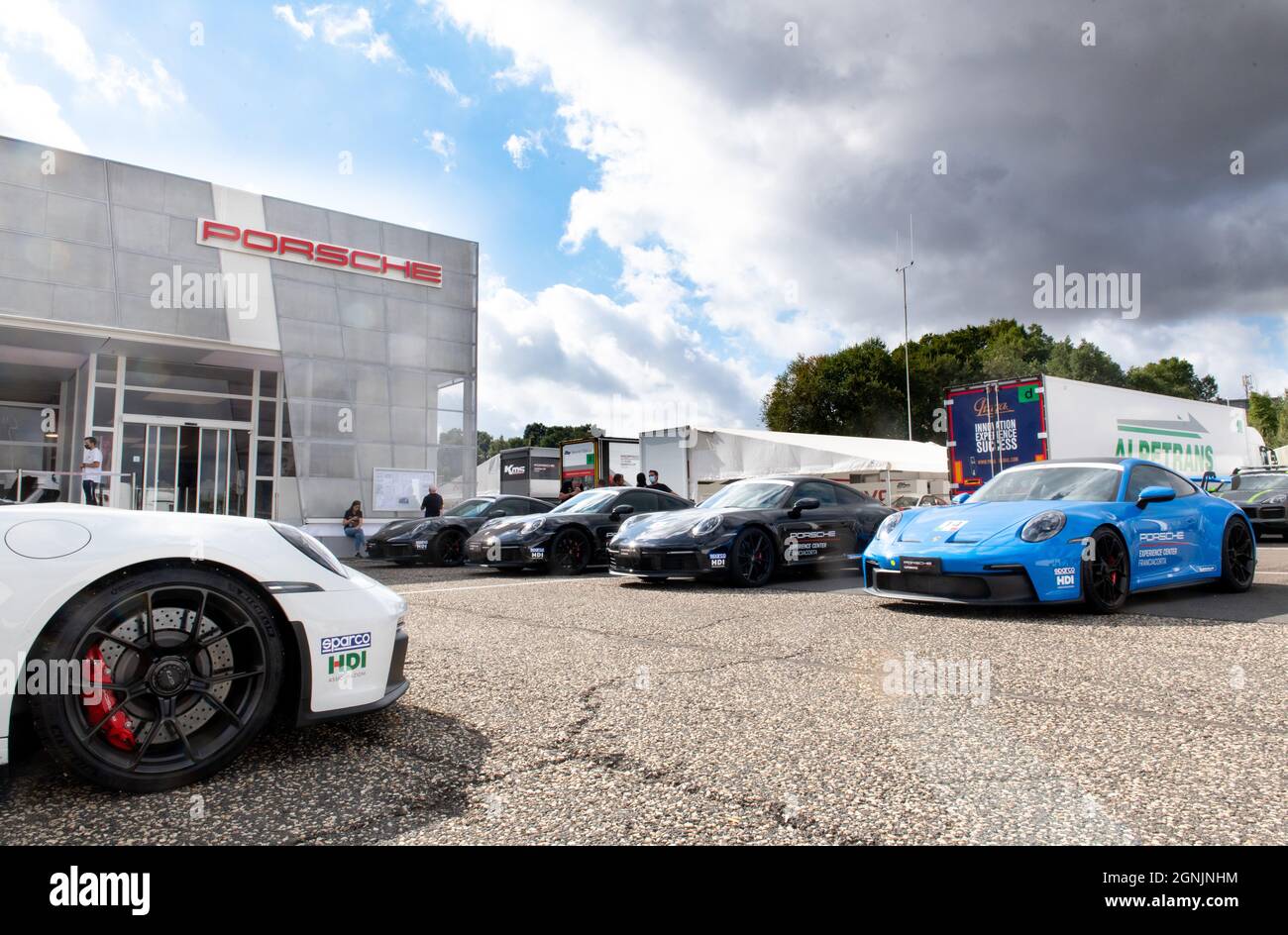 Vallelunga, italy september 19th 2021 Aci racing weekend. Many Prosche cars standing in front of showroom building Stock Photo