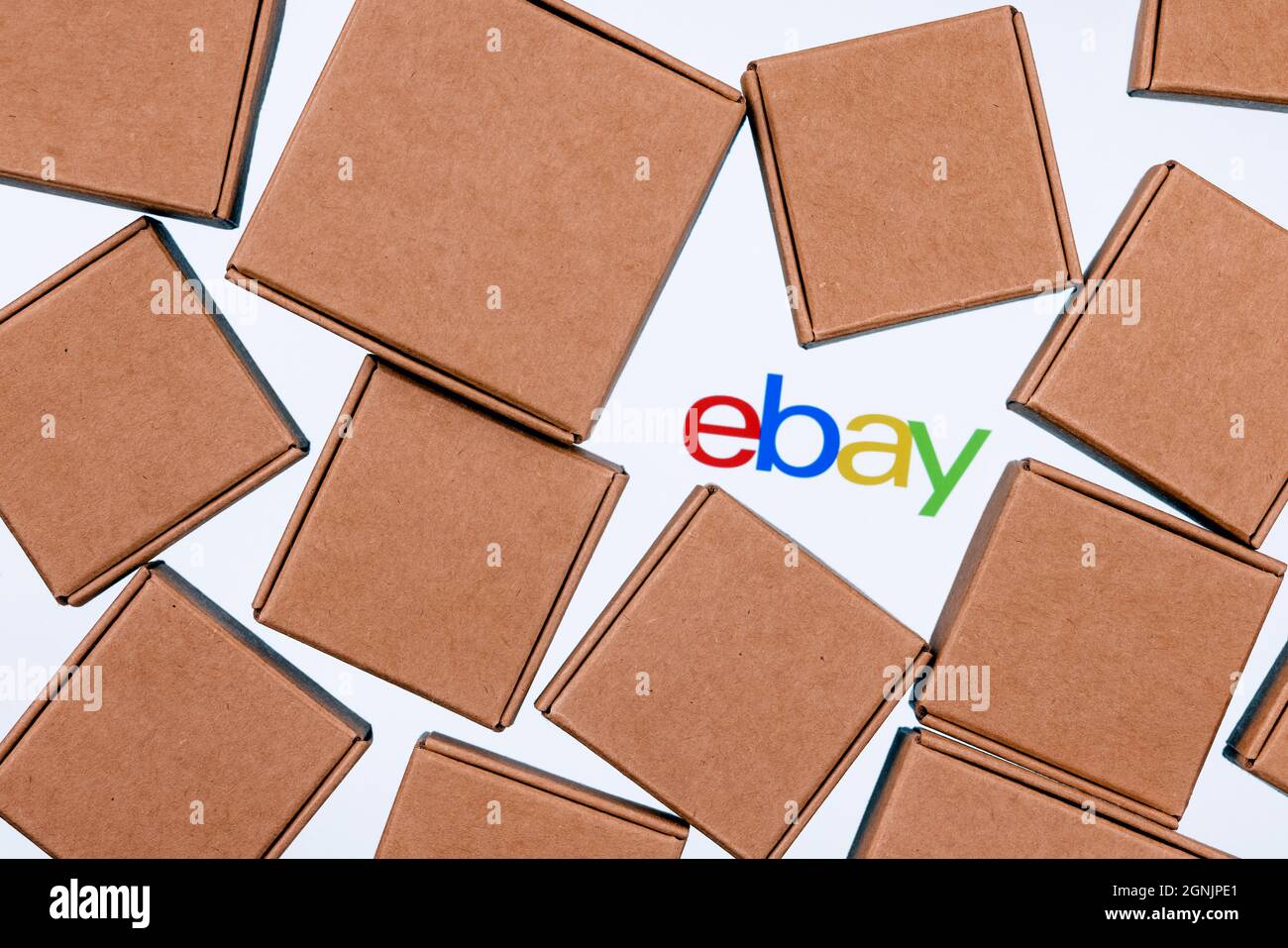 Ebay logo on a white background surrounded by parcel boxes Stock Photo Alamy