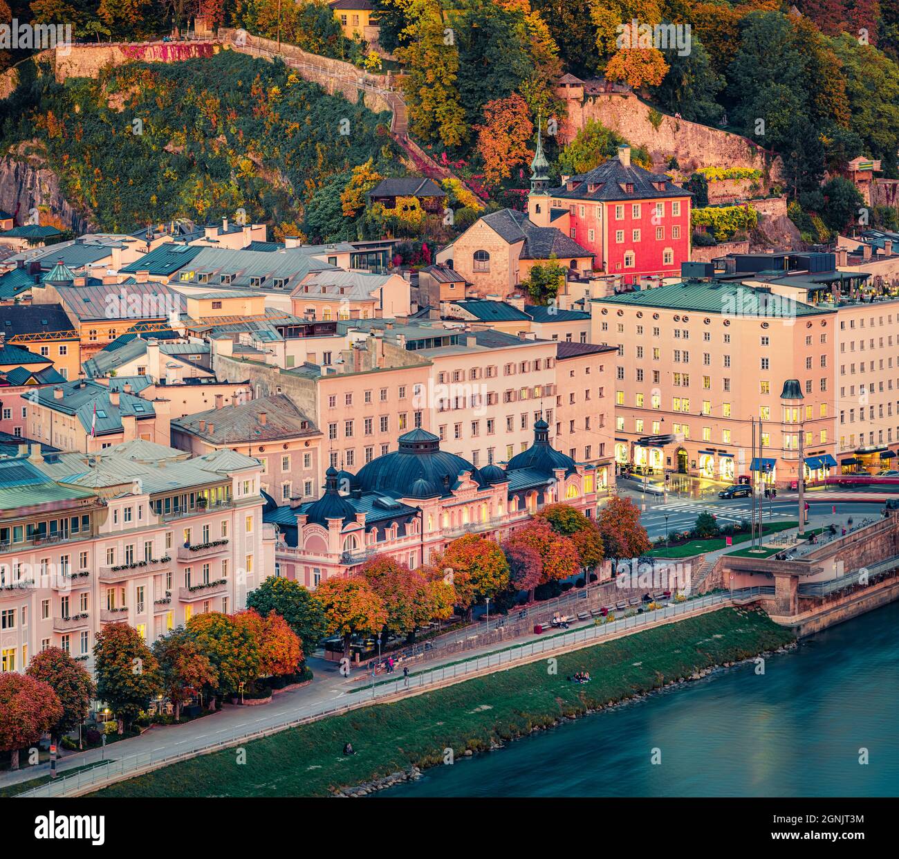 Wonderful evening cityscape of Salzburg town. Impressive autumn scene of Eastern Alps. Beautiful  landscape with Salzach river. Traveling concept back Stock Photo
